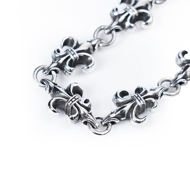 Fleur Cross Cut out Link Bracelet