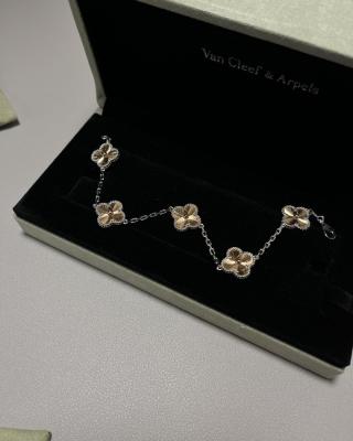 Van Cleef & Arpels Alhambra 5-motif bracelet featuring laser-engraved and mixed-color clover motifs.