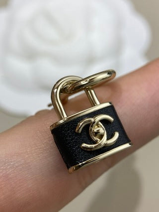 CHANEL Marcelline Lock Charm Stud Earrings