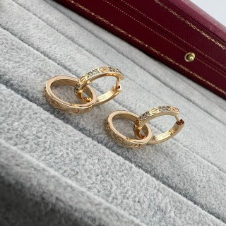 Cartier LOVE collection double-hoop earrings with screw motifs and half-set diamonds