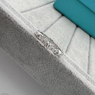 Tiffany narrow ring with three diamonds set between X-shaped motifs