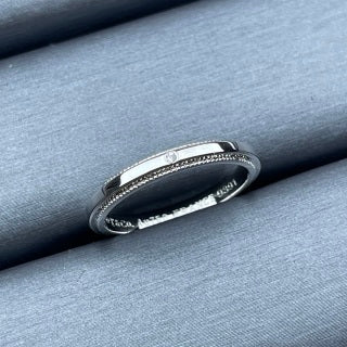 Tiffany narrow ring with a single diamond and square bead-edge detailing