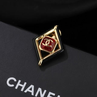CHANEL Delphine Ruby Diamond Emblem Brooch